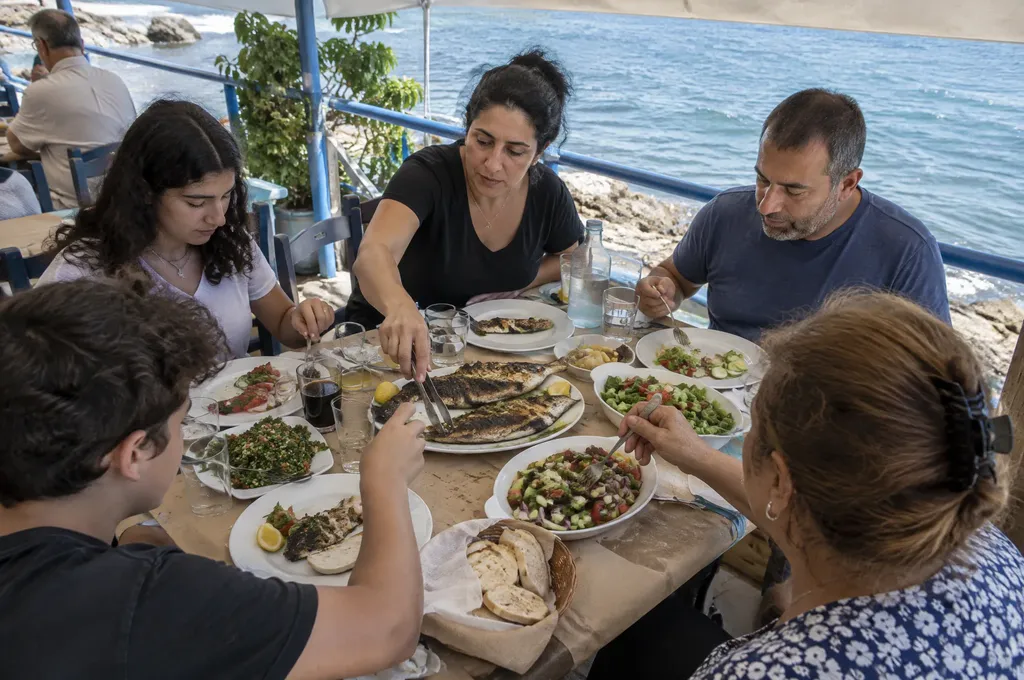 Family lunch at a seaside tavern in Limassol, Cyprus