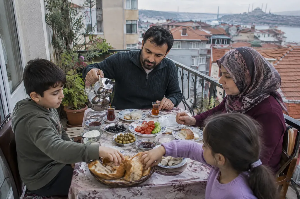 Family breakfast on an apartment balcony in Istanbul